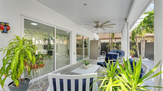 sunroom / solarium with ceiling fan