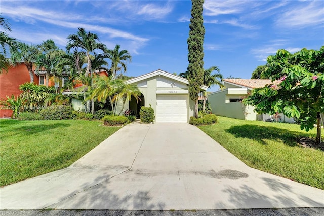 view of front facade with a garage and a front yard