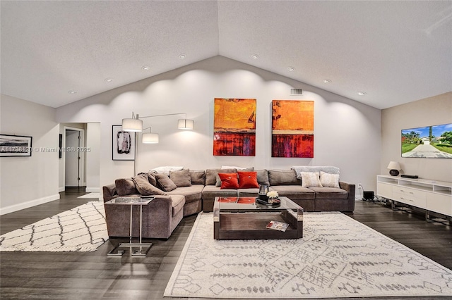 living room featuring dark hardwood / wood-style flooring, vaulted ceiling, and a textured ceiling