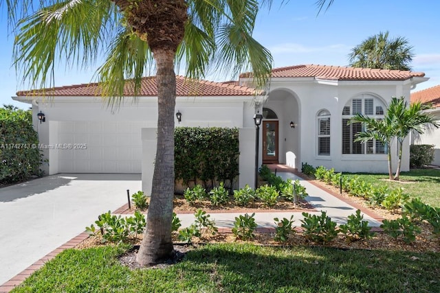 mediterranean / spanish-style house featuring a garage