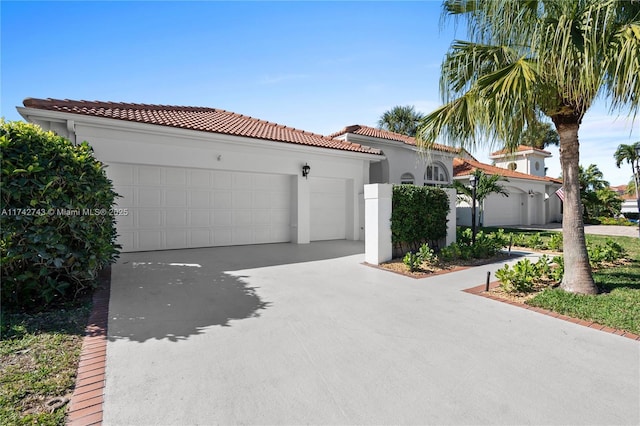 mediterranean / spanish-style home featuring a garage