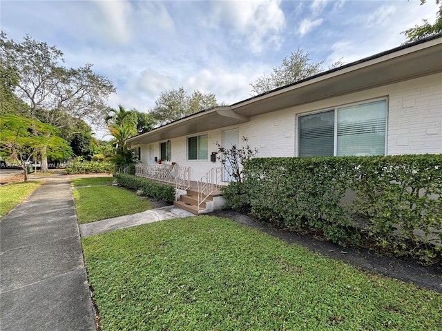 view of property exterior featuring a yard