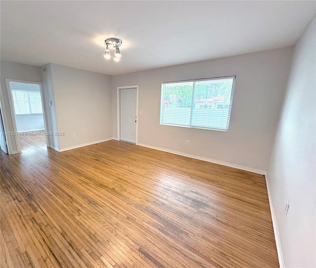 empty room with light hardwood / wood-style floors