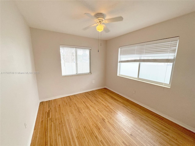 spare room featuring ceiling fan and light wood-type flooring