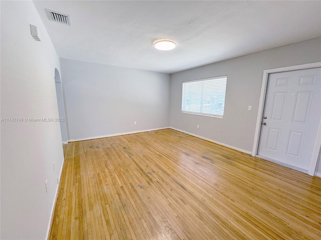 spare room featuring light wood-type flooring