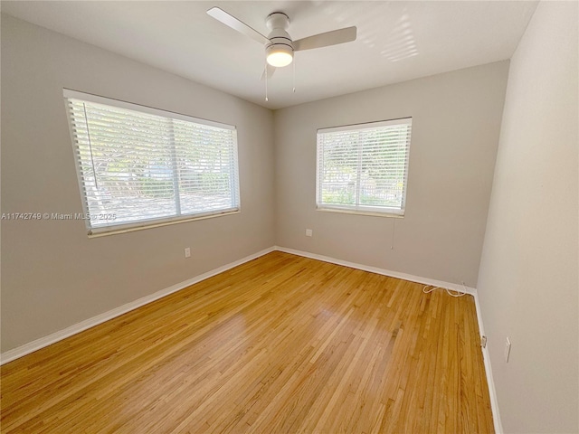 spare room with ceiling fan and light hardwood / wood-style flooring