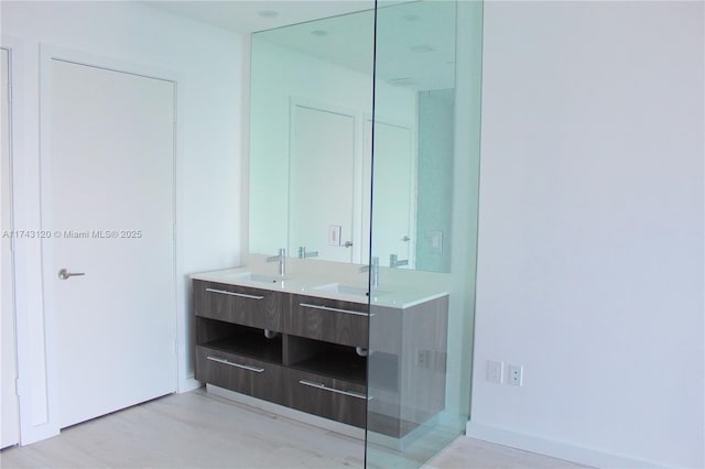 bathroom featuring vanity and wood-type flooring