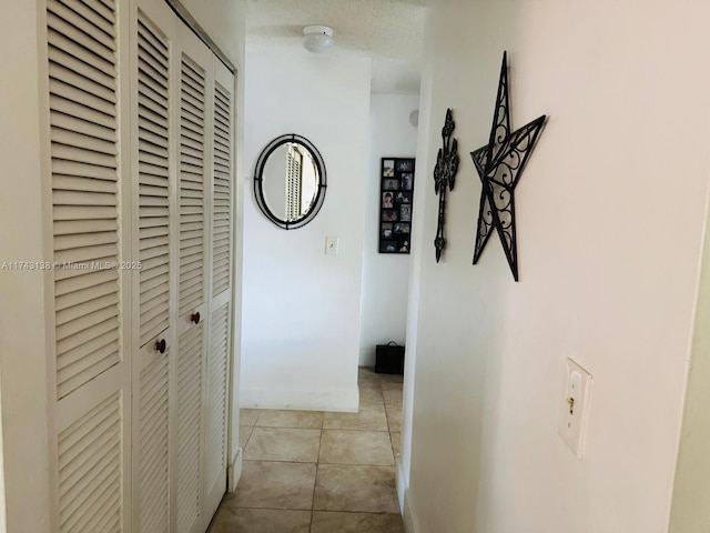 corridor featuring tile patterned flooring