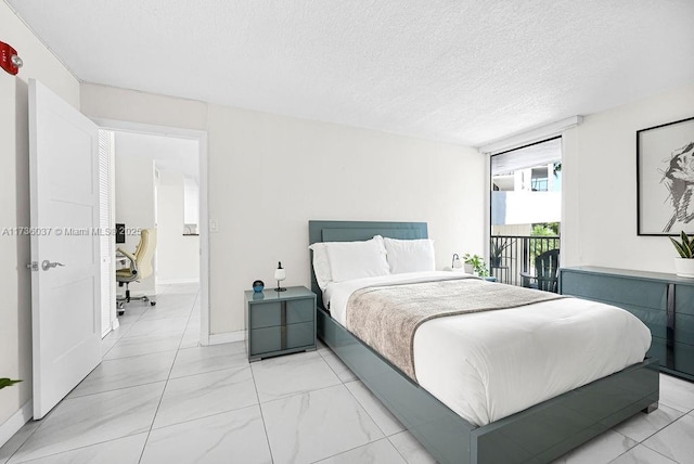 bedroom featuring a textured ceiling