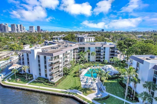 birds eye view of property with a water view