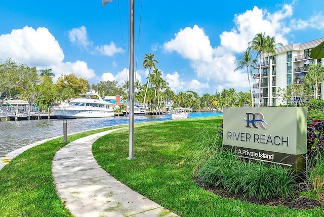 view of home's community featuring a water view and a yard