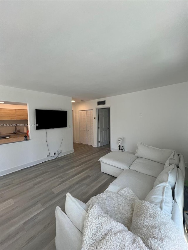 living room with dark hardwood / wood-style floors