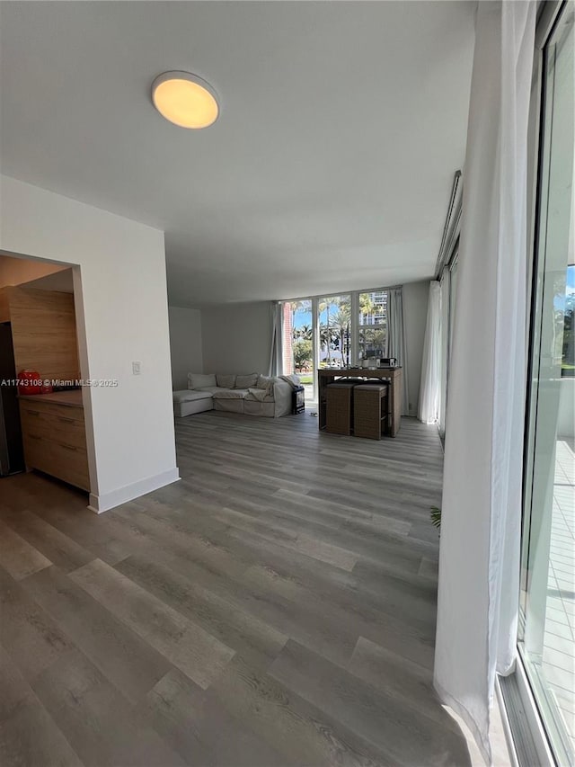 unfurnished living room with hardwood / wood-style flooring