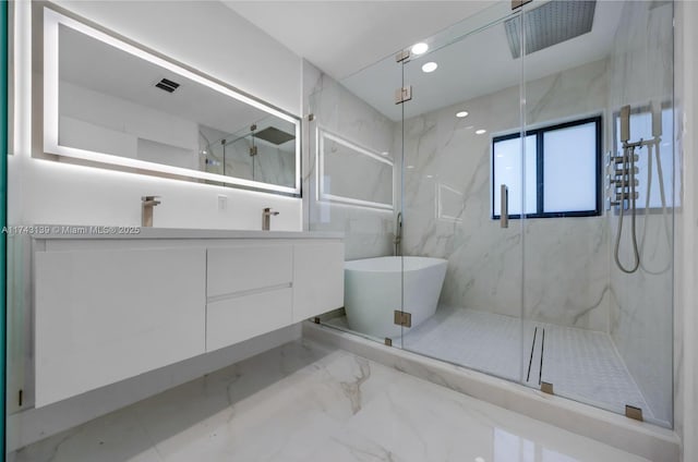 full bath featuring a marble finish shower, a soaking tub, marble finish floor, vanity, and recessed lighting