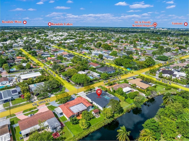 bird's eye view with a water view and a residential view