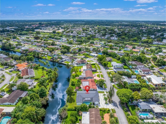 aerial view with a residential view and a water view