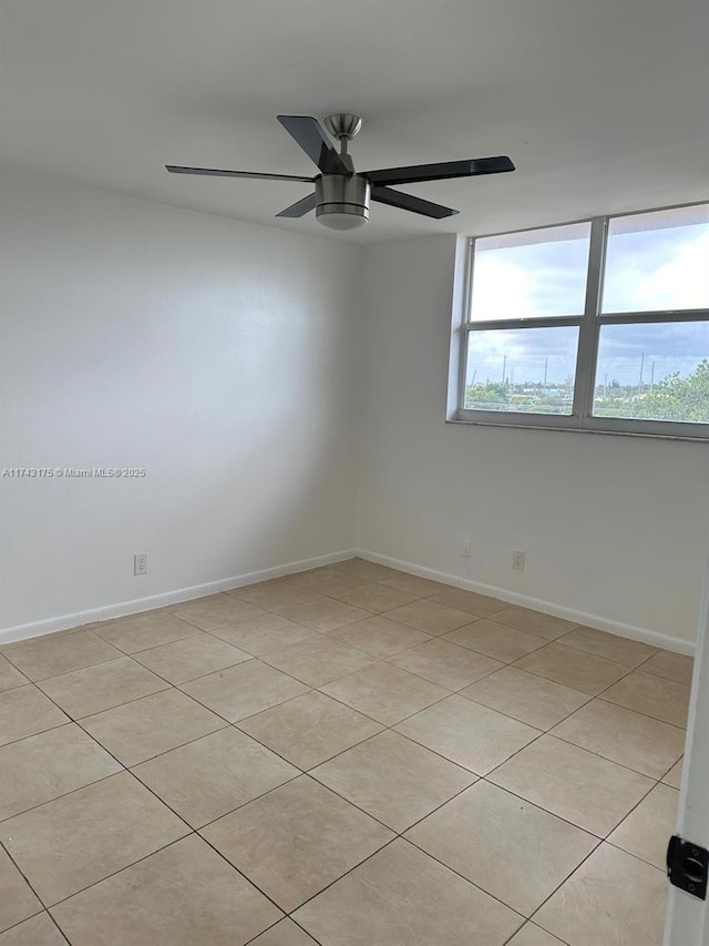 empty room with a wealth of natural light and ceiling fan