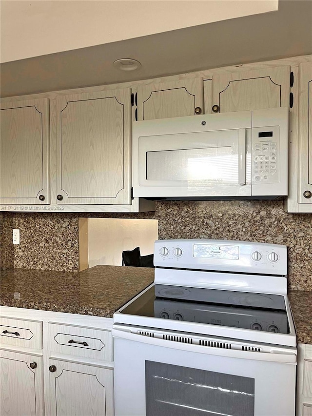 kitchen with white appliances and decorative backsplash