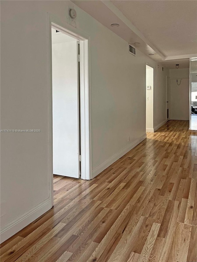 spare room with light hardwood / wood-style floors