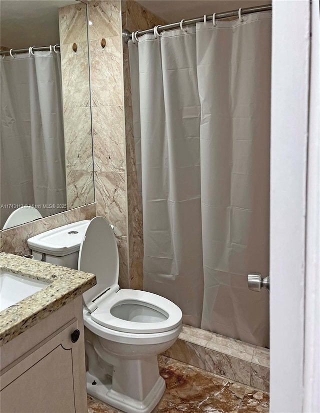 bathroom featuring vanity, a shower with curtain, and toilet