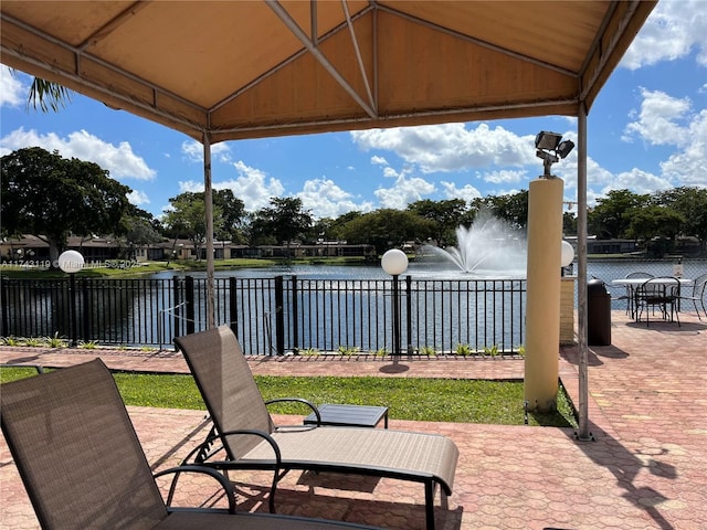 view of patio with a water view