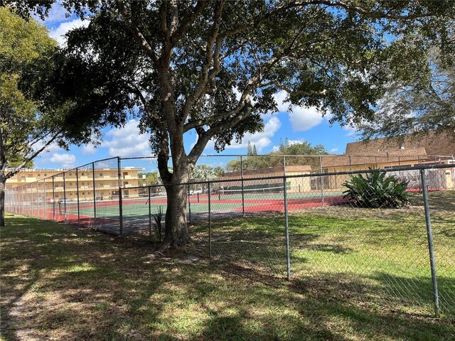 exterior space with tennis court