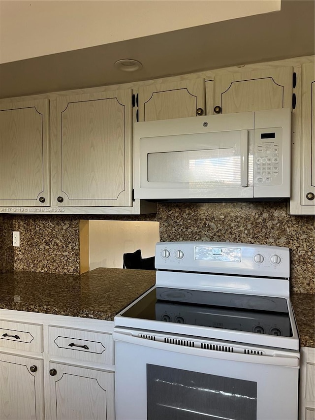 kitchen featuring tasteful backsplash and white appliances