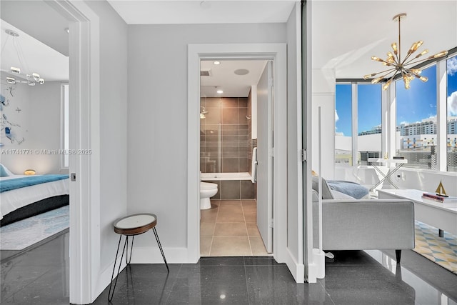 interior space with a tub to relax in, toilet, tile patterned flooring, and a notable chandelier