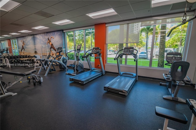 exercise room with a drop ceiling