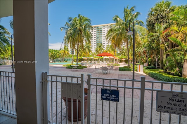 view of gate featuring a community pool