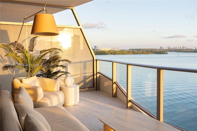 balcony featuring a water view