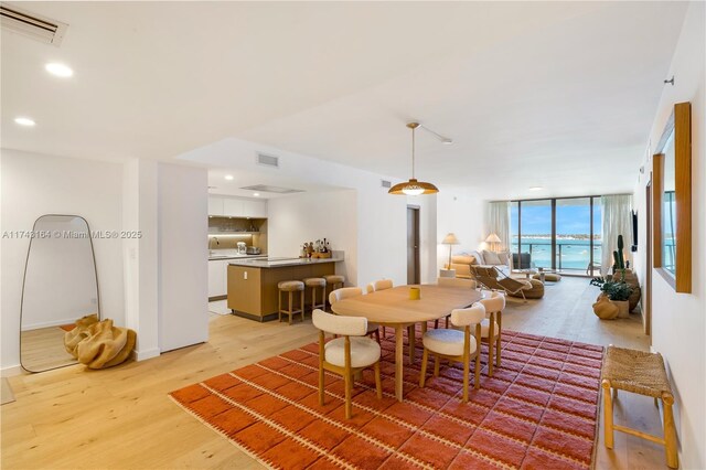 1135 103rd St Unit 602, Bay Harbor Islands, FL 33154 - dining space featuring light wood-style flooring and recessed lighting