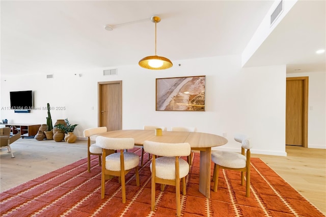 1135 103rd St Unit 602, Bay Harbor Islands, FL 33154 - dining room with light wood finished floors and baseboards