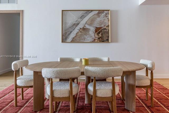 dining room featuring hardwood / wood-style flooring