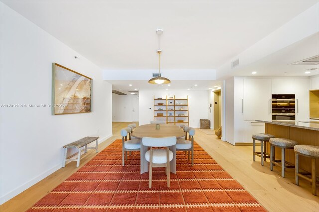 1135 103rd St Unit 602, Bay Harbor Islands, FL 33154 - dining room with light wood finished floors and recessed lighting