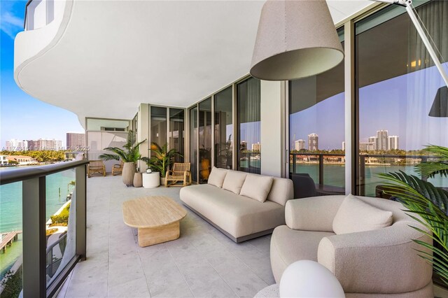 1135 103rd St Unit 602, Bay Harbor Islands, FL 33154 - balcony with a view of city, an outdoor hangout area, and a water view