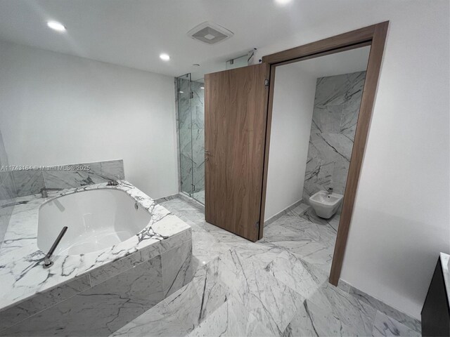 bathroom with a bidet and independent shower and bath