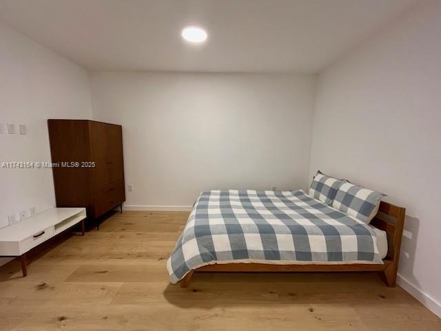 bedroom featuring light hardwood / wood-style floors