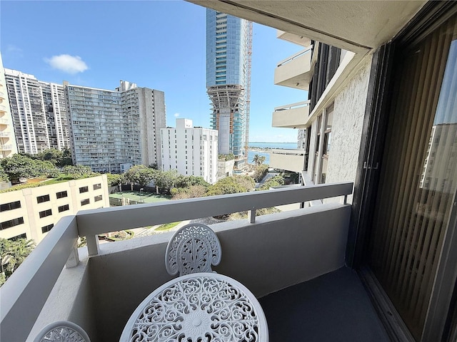 balcony featuring a water view