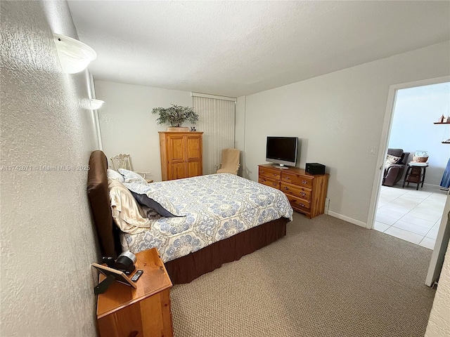 carpeted bedroom featuring a textured ceiling