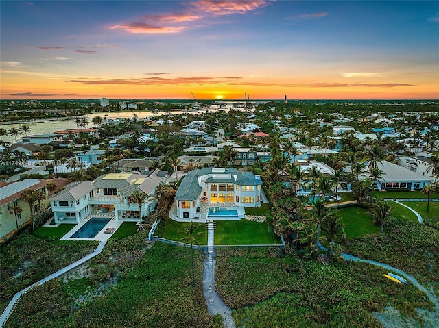 aerial view at dusk with a water view