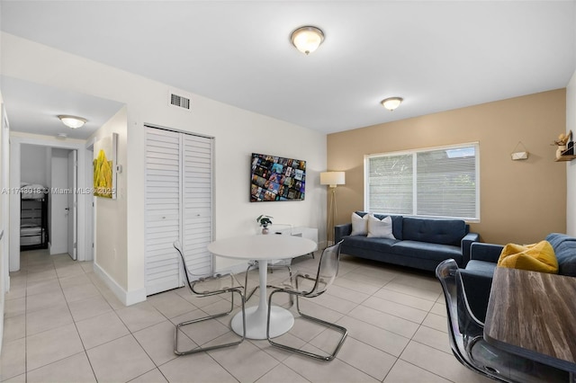 dining space featuring light tile patterned floors