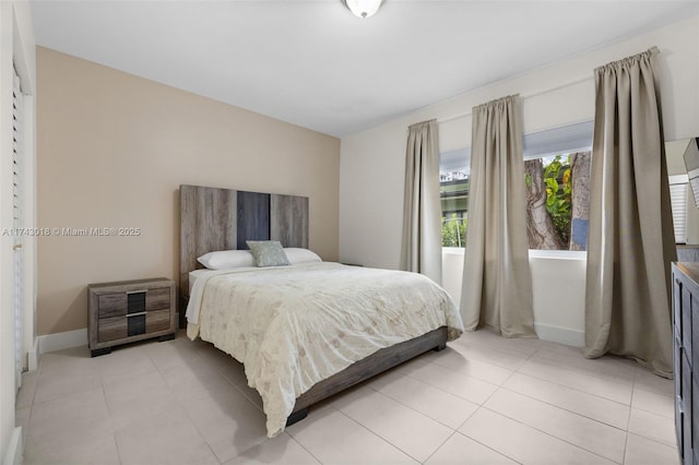 bedroom with light tile patterned flooring