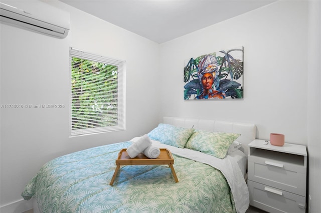 bedroom featuring an AC wall unit