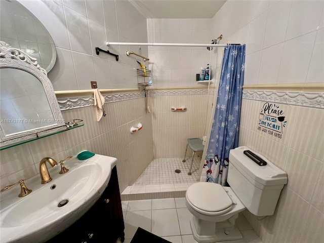 bathroom featuring tile walls, vanity, walk in shower, toilet, and tile patterned floors