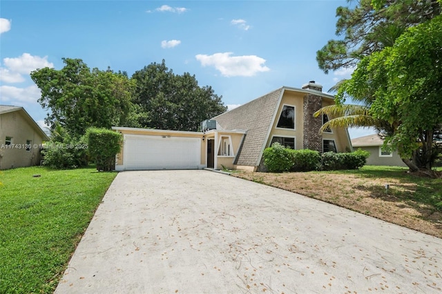 view of front of home featuring a garage and a front yard