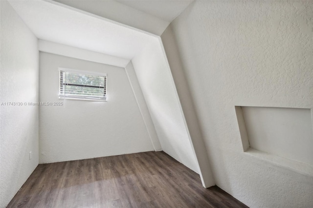 empty room with dark hardwood / wood-style flooring