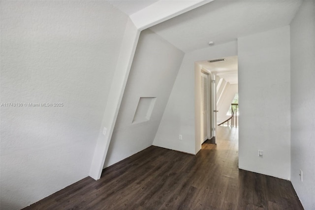 corridor with dark hardwood / wood-style floors