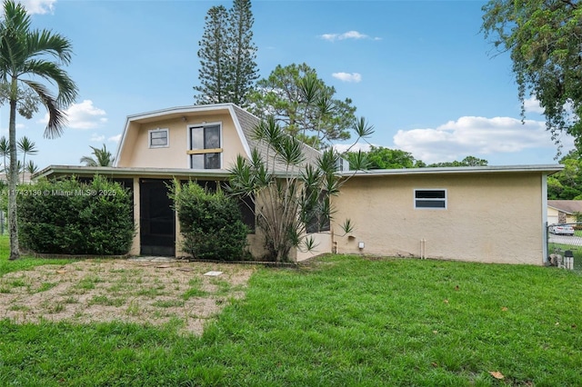 back of house with a yard