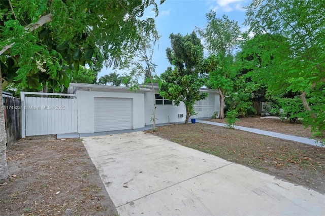 single story home featuring a garage